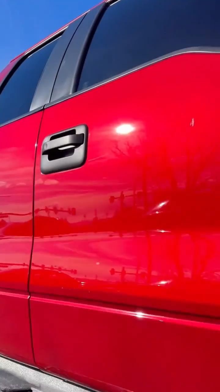 Glossy red truck door after ceramic coating